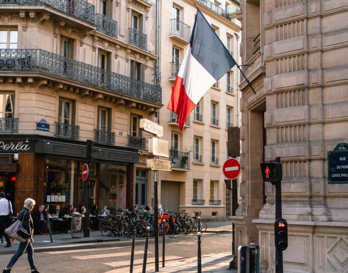 France Flag on Gray Concrete Building Near Road