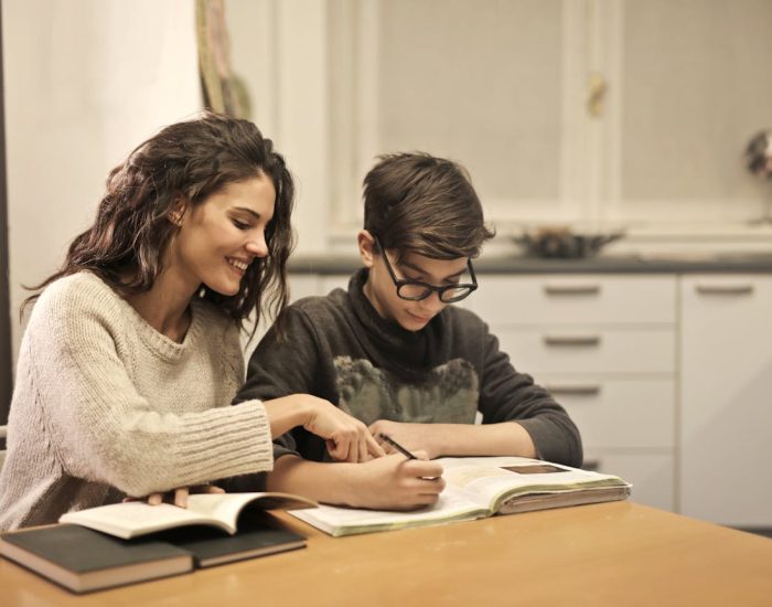 A Girl home tutors teaching her Students.