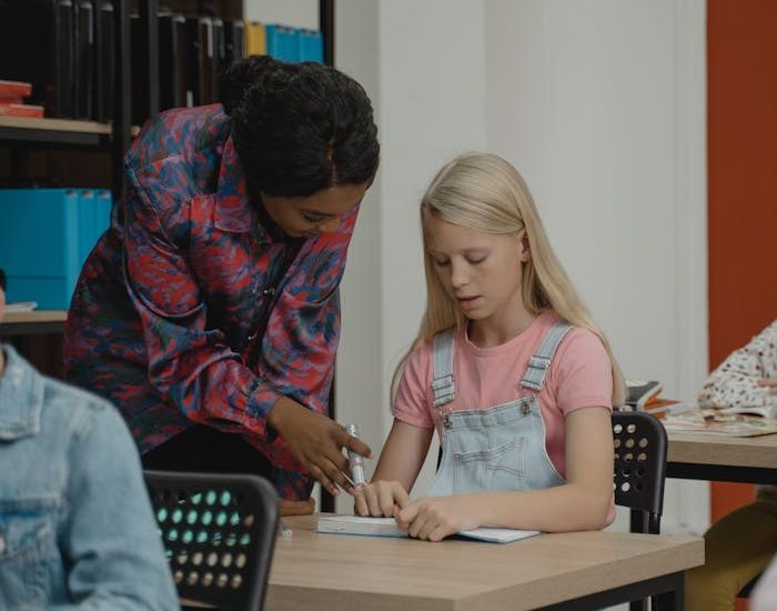 A female home tutors helping her students